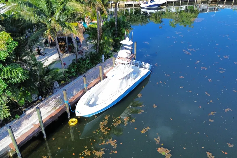 Slide: The Image of Aerial view of 2014 SeaHunter 45 Tournament boat docked by tropical foliage. - 24