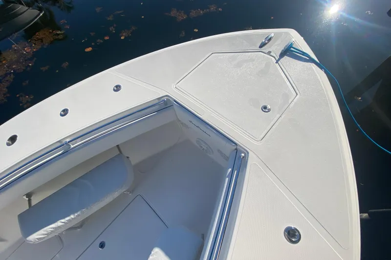 Slide: The Image of Bow of 2014 SeaHunter 45 Tournament boat with sleek white deck and seating. - 27