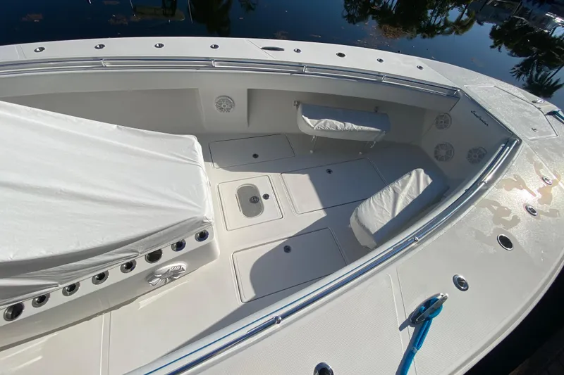 Slide: The Image of 2014 SeaHunter 45 Tournament boat deck with seating and storage compartments. - 31