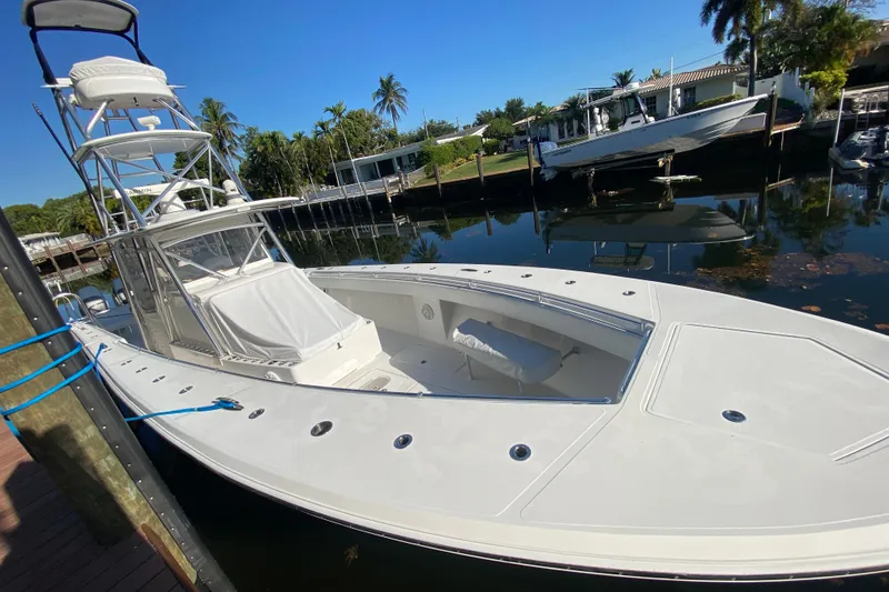 Slide: The Image of 2014 SeaHunter 45 Tournament boat docked in a serene marina setting. - 33