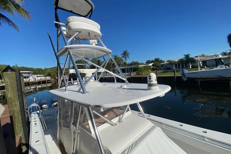 Slide: The Image of 2014 SeaHunter 45 Tournament boat docked, featuring a tower and clear blue sky. - 34