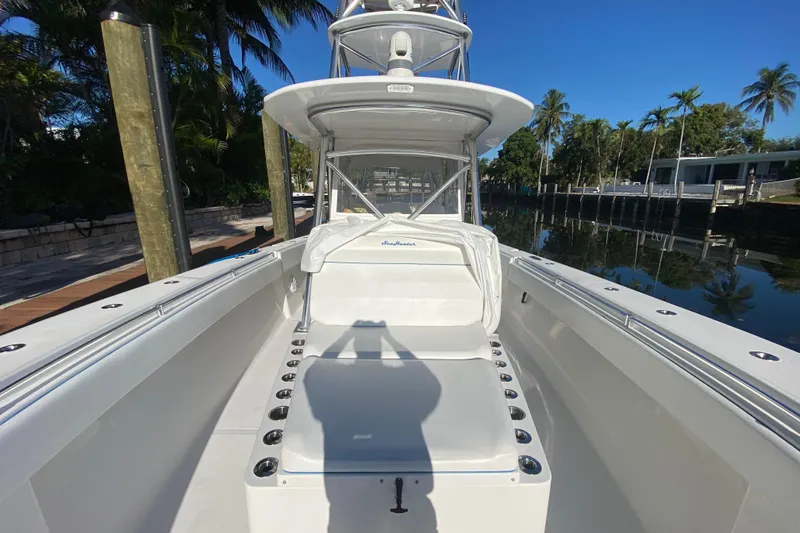 Slide: The Image of 2014 SeaHunter 45 Tournament boat docked, showcasing spacious deck and seating area. - 36