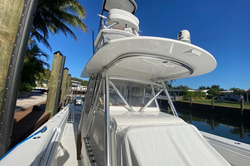 Slide: The Image of 2014 SeaHunter 45 Tournament boat docked under clear blue sky. - 37