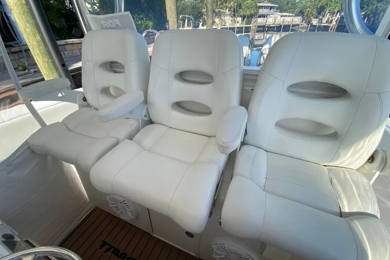 Slide: The Image of Luxurious white seating on a 2014 SeaHunter 45 Tournament boat, showcasing comfort and style. - 40