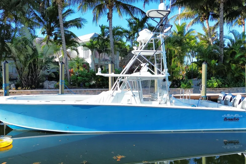 Slide: The Image of 2014 SeaHunter 45 Tournament boat docked, surrounded by tropical palm trees. - 5