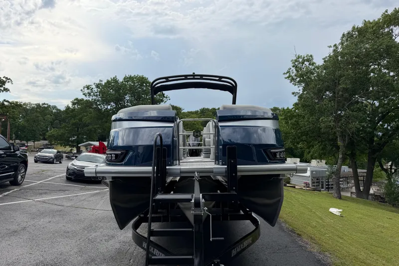 Slide: The Image of 2026 Harris Grand Mariner 250 CWDH pontoon boat on trailer in parking lot. - 5