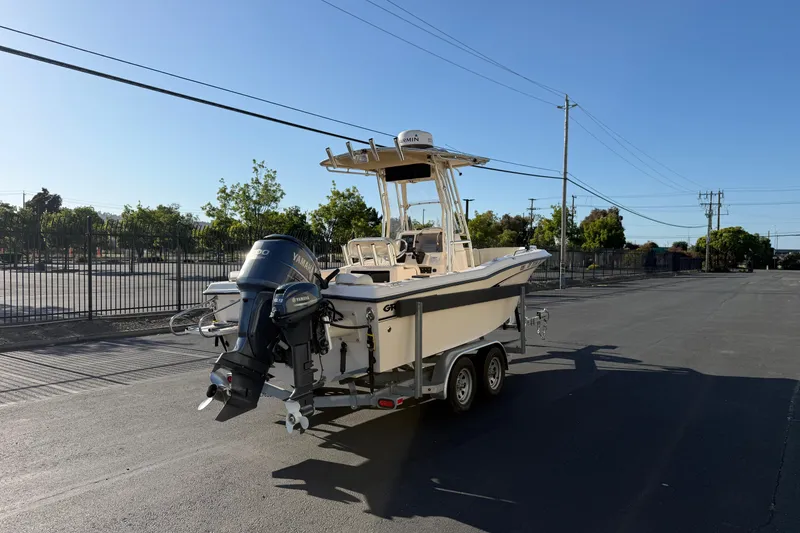 Slide: The Image of 2007 Grady-White Escape 209 boat on trailer, parked in sunny lot. - 11