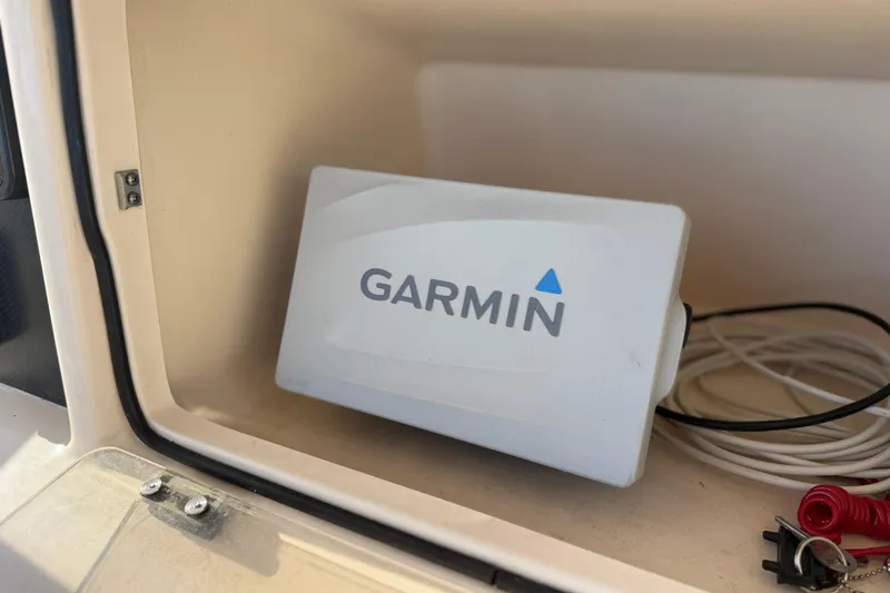 Slide: The Image of Garmin device inside a 2007 Grady-White Escape 209 boat compartment. - 19