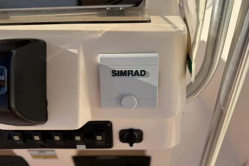 Slide: The Image of Simrad control panel on 2007 Grady-White Escape 209 boat dashboard. - 20