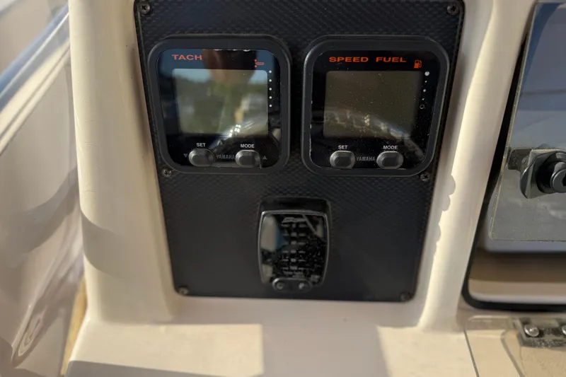 Slide: The Image of Dashboard of 2007 Grady-White Escape 209 boat with Yamaha tachometer and speed fuel gauges. - 21