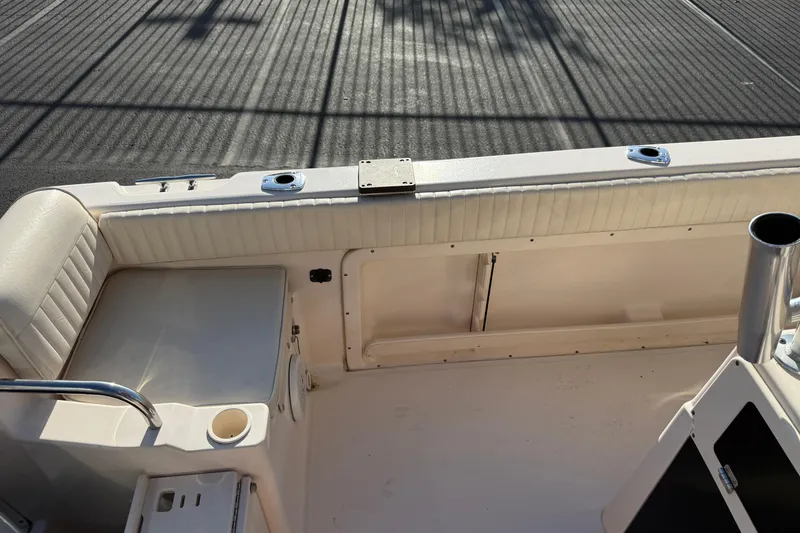 Slide: The Image of 2007 Grady-White Escape 209 boat interior with seating and storage compartments. - 29