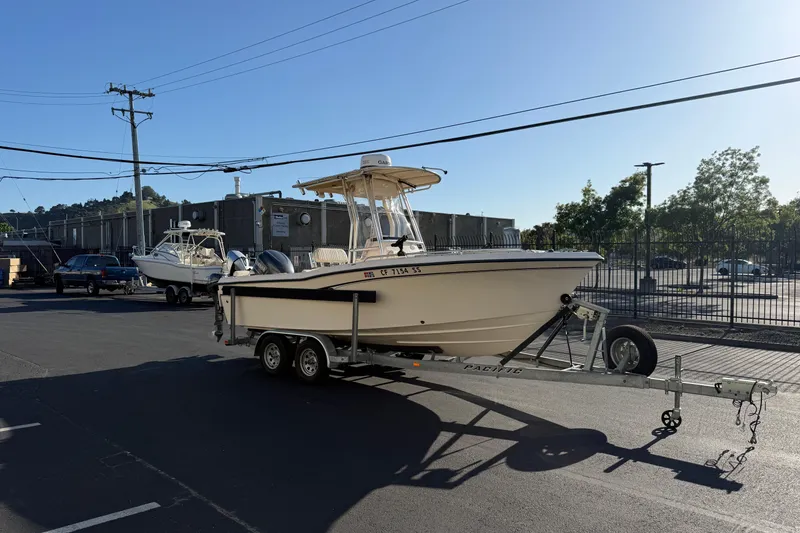 The Image of 2007 Grady-White Escape 209 boat on trailer in parking lot. - 3