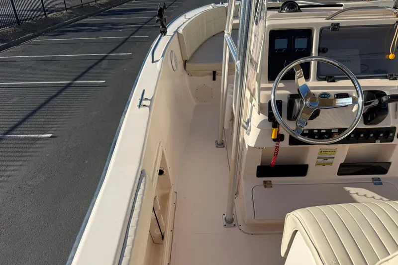 Slide: The Image of 2007 Grady-White Escape 209 boat interior with steering wheel and control panel. - 30