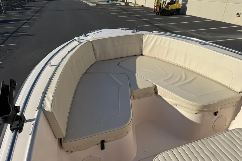 Slide: The Image of 2007 Grady-White Escape 209 boat with cushioned seating in a parking lot. - 31