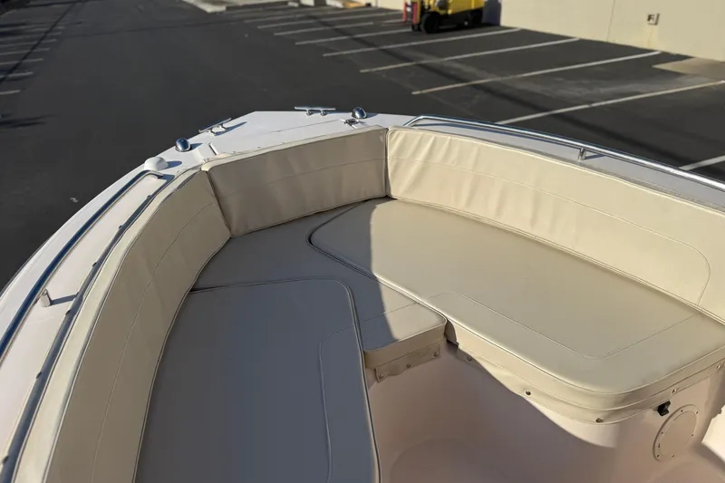 Slide: The Image of 2007 Grady-White Escape 209 boat with beige seating in a parking lot. - 34