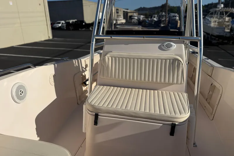 Slide: The Image of 2007 Grady-White Escape 209 boat interior with cushioned seating and speaker. - 35