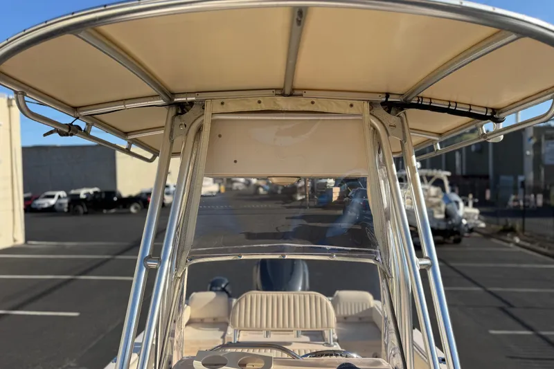 Slide: The Image of 2007 Grady-White Escape 209 boat with T-top, parked in a marina setting. - 38