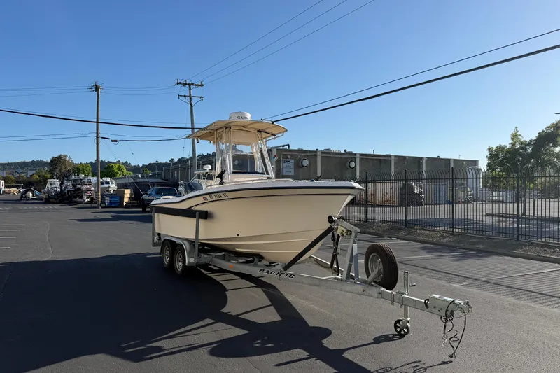 Slide: The Image of 2007 Grady-White Escape 209 boat on trailer in industrial parking lot. - 4