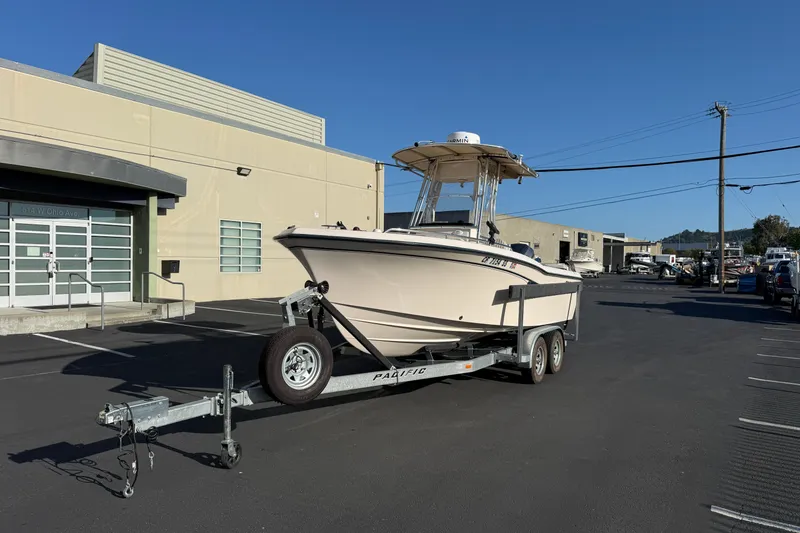 Slide: The Image of 2007 Grady-White Escape 209 boat on trailer in parking lot, sunny day. - 6
