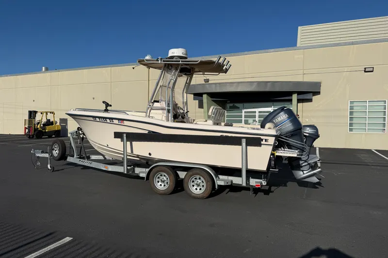 Slide: The Image of 2007 Grady-White Escape 209 boat on trailer, parked outside industrial building. - 8
