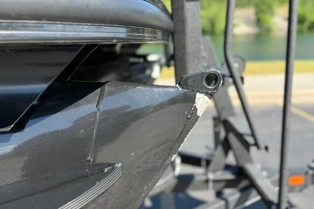 Slide: The Image of Close-up of a 2025 Regency 250 DL3 boat hull on a trailer. - 17