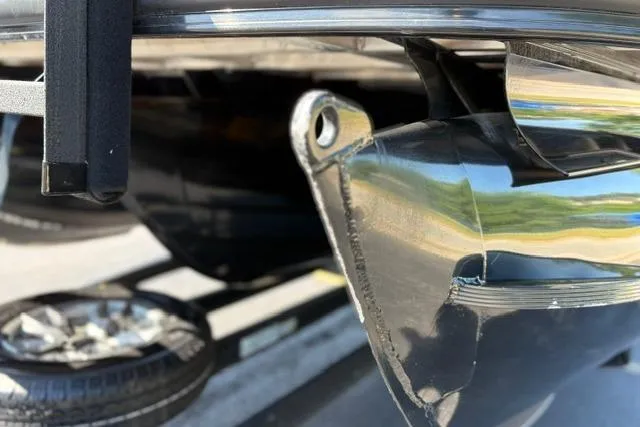 Slide: The Image of Close-up of a 2025 Regency 250 DL3 boat component, showcasing metallic details. - 23