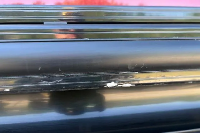 Slide: The Image of Close-up of 2025 Regency 250 DL3 with visible scratches on the surface. - 28