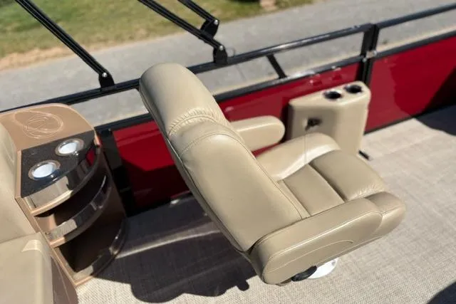 Slide: The Image of Luxurious seating on 2025 Regency 250 DL3 pontoon boat with beige upholstery. - 33