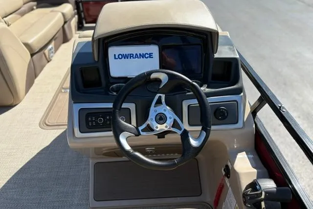 Slide: The Image of Steering console of 2025 Regency 250 DL3 boat with Lowrance navigation system. - 36