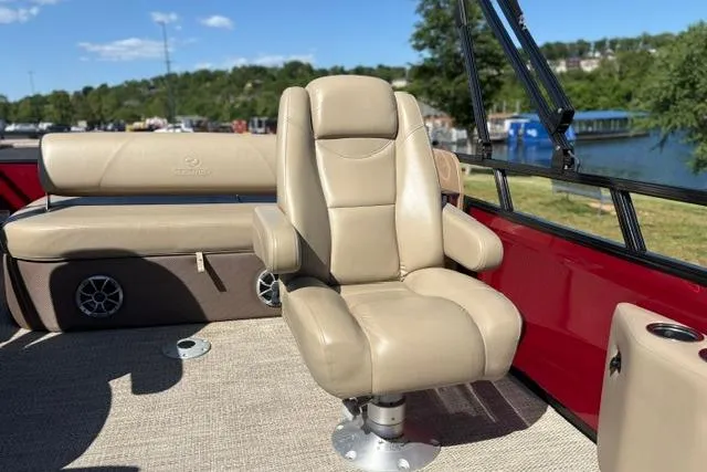 Slide: The Image of Luxurious seating on 2025 Regency 250 DL3 boat with scenic lake view. - 40