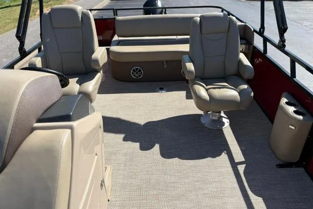 Slide: The Image of 2025 Regency 250 DL3 boat interior with beige seating and carpeted flooring. - 50