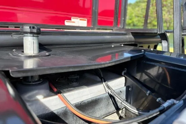 Slide: The Image of 2025 Regency 250 DL3 boat battery compartment with visible wiring and components. - 51