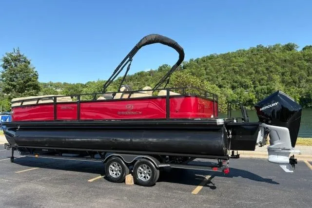 Slide: The Image of 2025 Regency 250 DL3 pontoon boat on trailer, parked in sunny outdoor setting. - 8