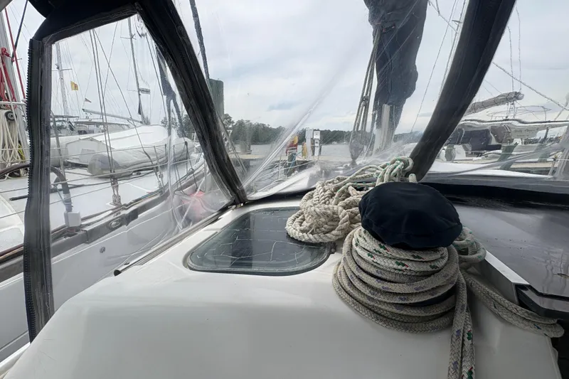 Slide: The Image of Cockpit view of 1989 Hunter Vision 32 sailboat with ropes and clear canopy. - 21