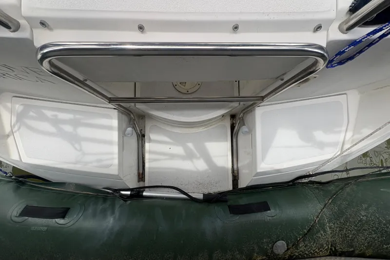 Slide: The Image of 1989 Hunter Vision 32 boat stern with stainless steel railing and inflatable dinghy. - 28