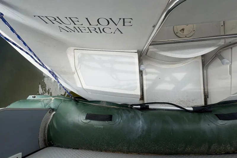 Slide: The Image of Hunter Vision 32 sailboat, 1989 model, with "True Love America" text on the sail. - 29