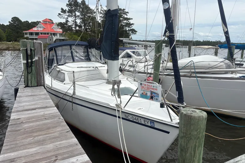 Slide: The Image of Sailboat Hunter Vision 32, 1989 model, docked with a "For Sale" sign. - 3