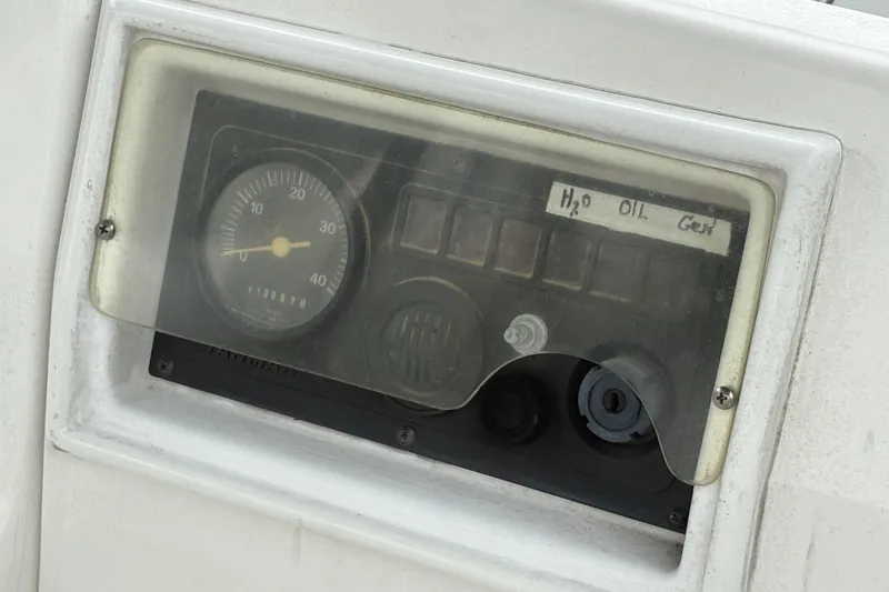 Slide: The Image of Instrument panel of a 1989 Hunter Vision 32 sailboat with RPM gauge and indicators. - 30
