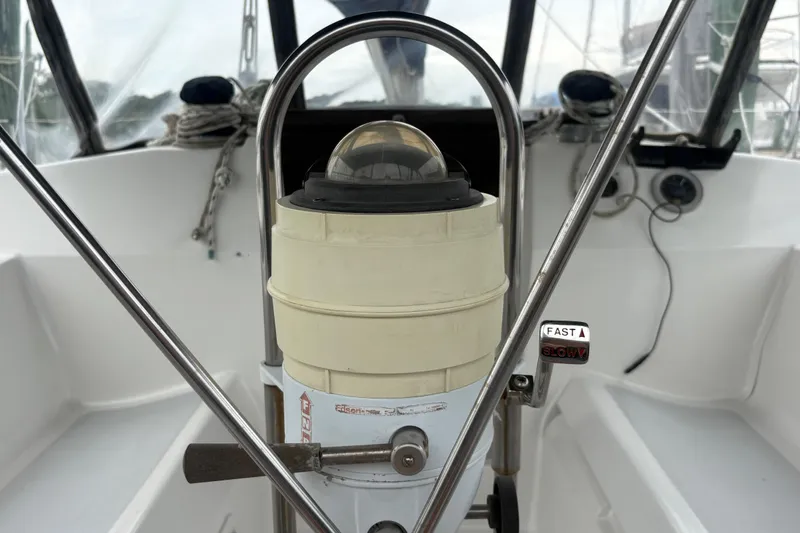 Slide: The Image of Cockpit of 1989 Hunter Vision 32 sailboat with steering wheel and navigation instruments. - 31