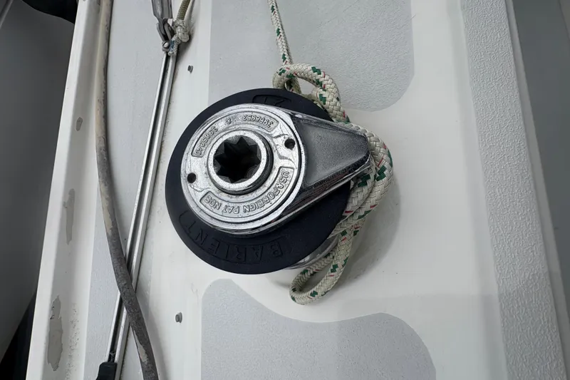 Slide: The Image of Winch on 1989 Hunter Vision 32 sailboat deck with rope coiled around. - 34