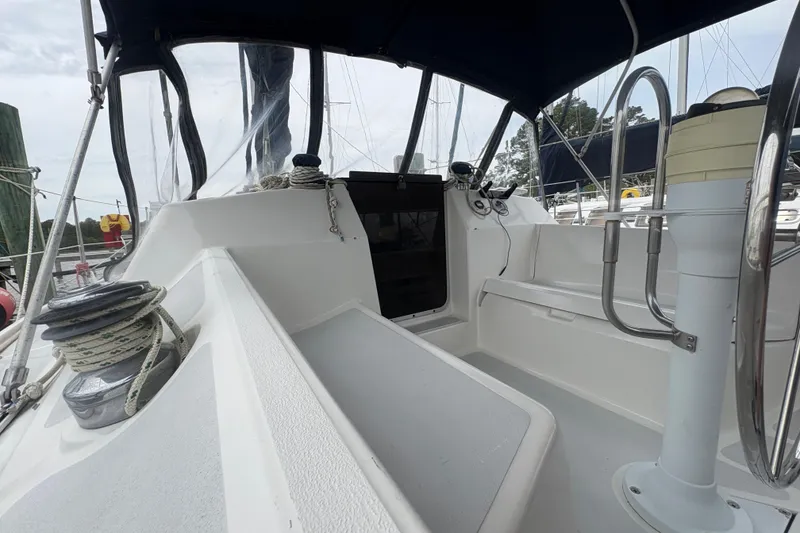 Slide: The Image of Cockpit of 1989 Hunter Vision 32 sailboat with steering wheel and winch. - 36