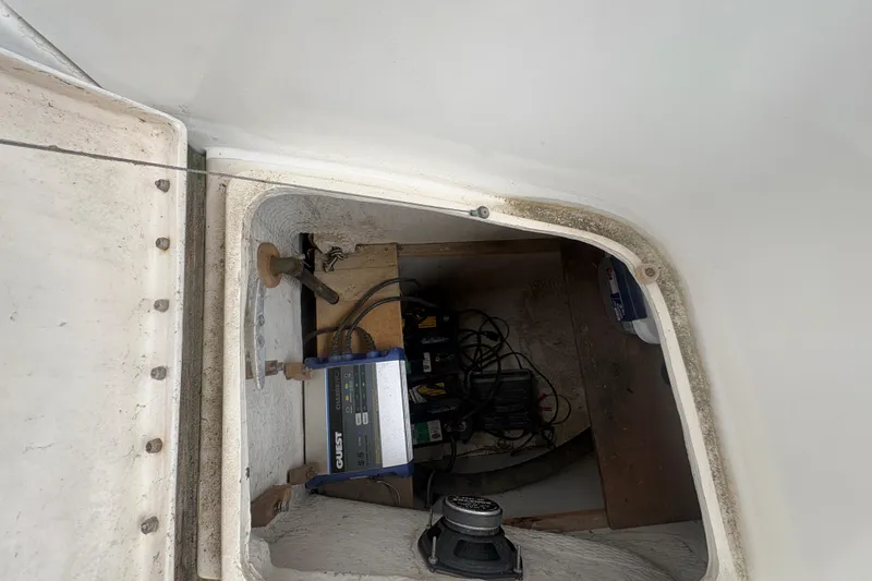 Slide: The Image of Electrical compartment of a 1989 Hunter Vision 32 sailboat, featuring wiring and equipment. - 37