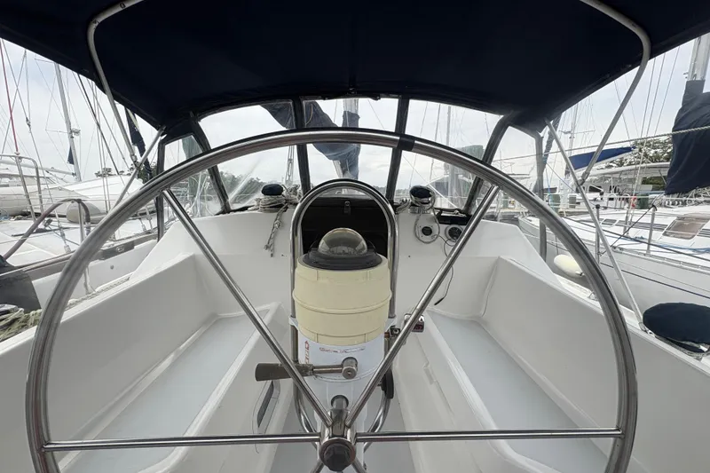 Slide: The Image of Cockpit view of 1989 Hunter Vision 32 sailboat with steering wheel and compass. - 40