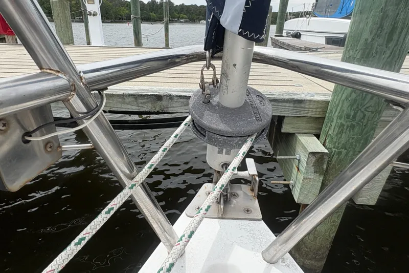 Slide: The Image of Bow of 1989 Hunter Vision 32 sailboat docked, showing rigging and deck details. - 5
