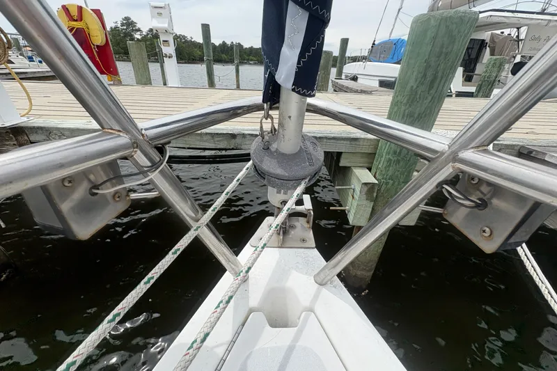 Slide: The Image of Bow of 1989 Hunter Vision 32 sailboat docked at marina with ropes and fittings. - 6