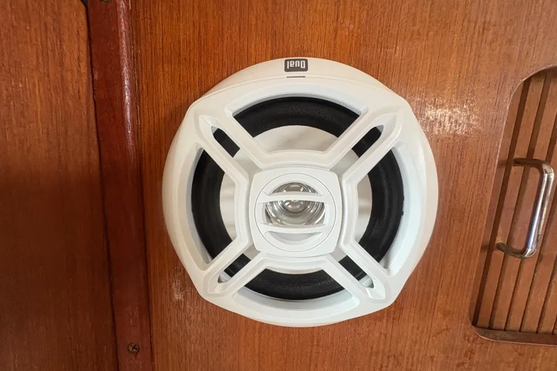 Slide: The Image of White Dual speaker mounted on wooden panel of 1989 Hunter Vision 32 boat. - 63