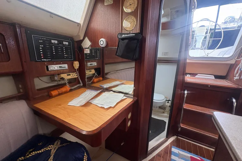 Slide: The Image of Interior of 1989 Hunter Vision 32 sailboat with navigation station and cozy cabin. - 67