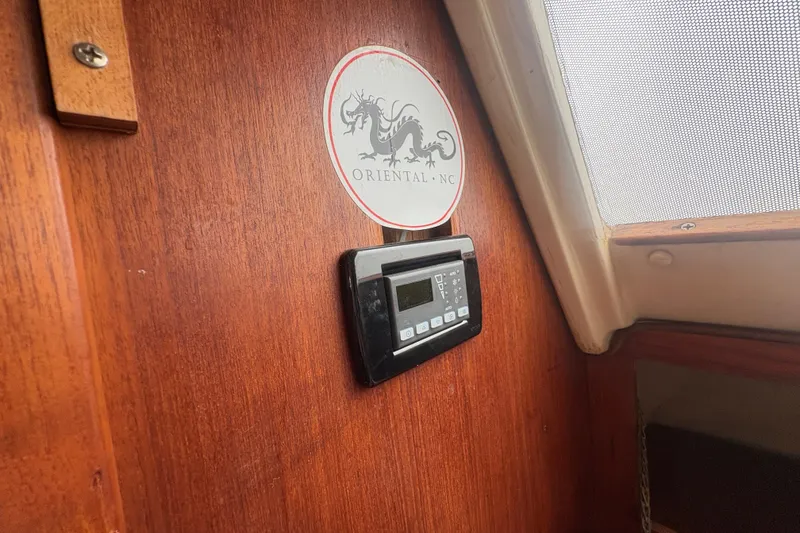 Slide: The Image of Interior of 1989 Hunter Vision 32 sailboat with Oriental, NC sticker and control panel. - 71