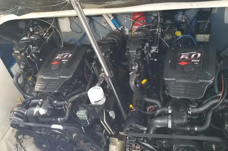 Slide: The Image of Engine compartment of a 2004 Sea Ray 300 Sundancer with twin MerCruiser 5.0 MPI engines. - 13
