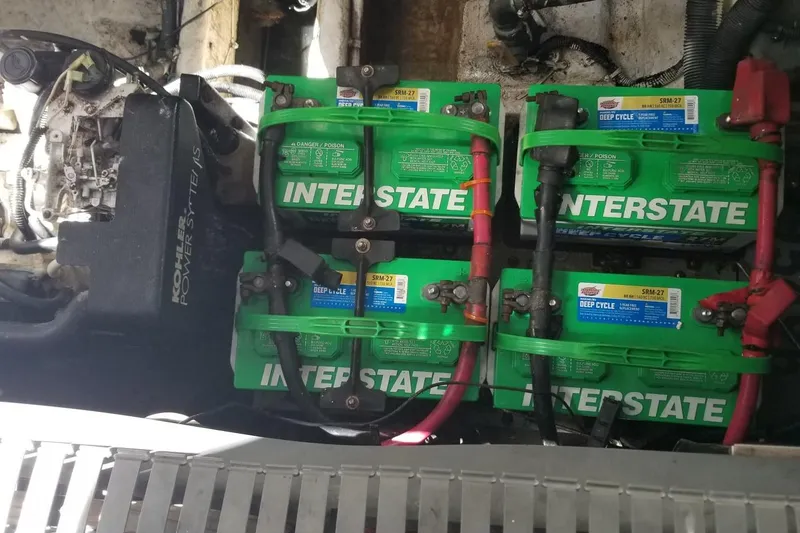 Slide: The Image of Engine compartment of a 2004 Sea Ray 300 Sundancer with Interstate deep cycle batteries. - 15